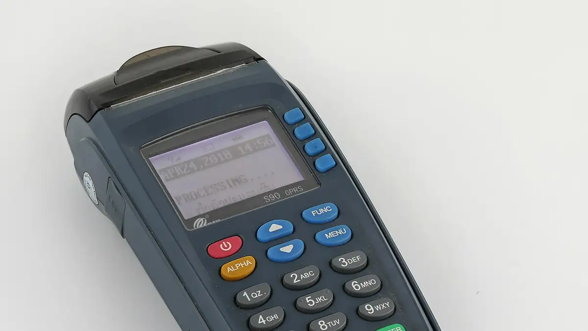 Processing credit card terminal with a visa card inserted, in Laos. Picture made by the focus stacking technique from 4 images (Helicon focu